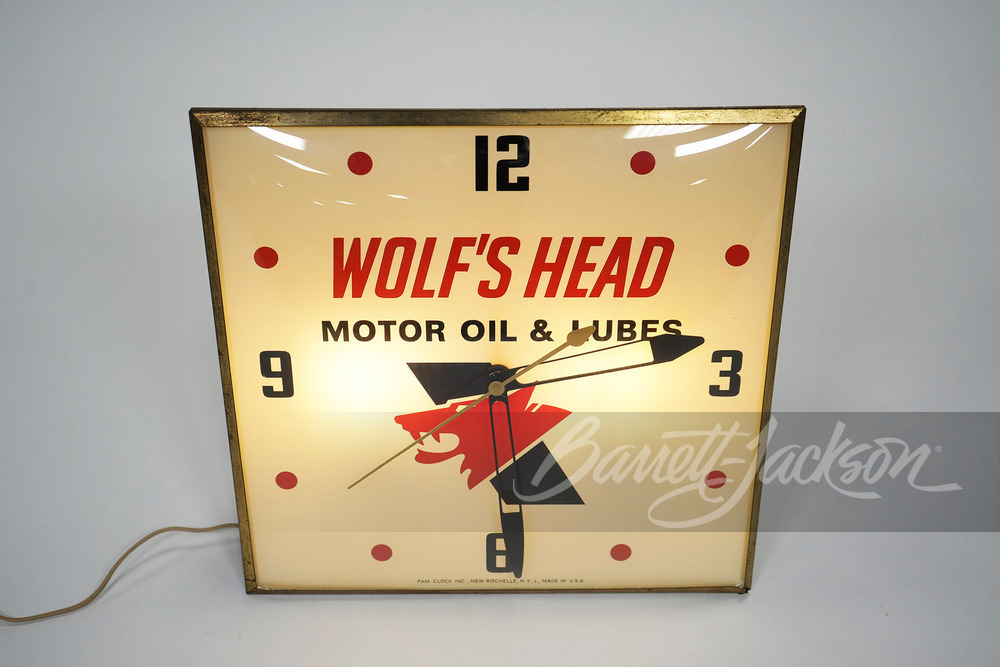 EARLY 1960S WOLF'S HEAD MOTOR OIL LIGHT-UP CLOCK