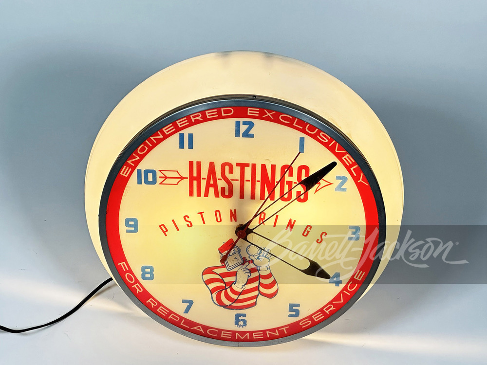 LATE 1950S HASTINGS PISTON RINGS LIGHT-UP CLOCK