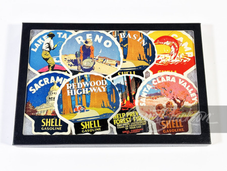 DISPLAY CASE OF EIGHT CIRCA 1920S SHELL OIL WINDOW DECALS